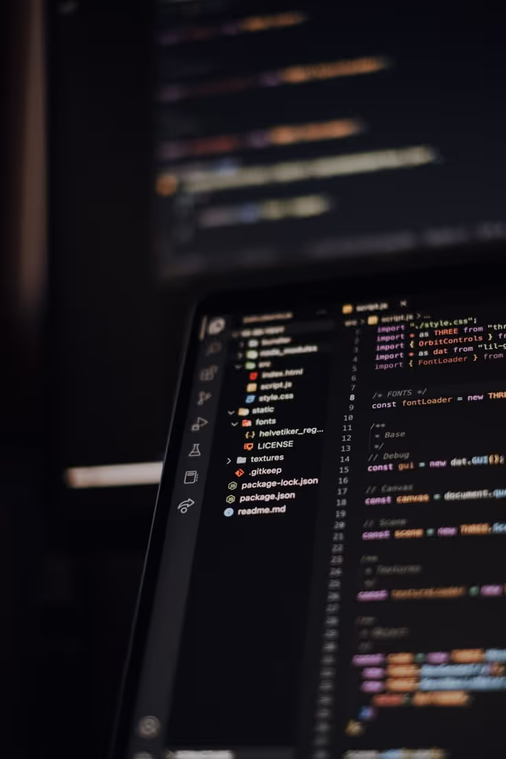 laptop with coding screen
